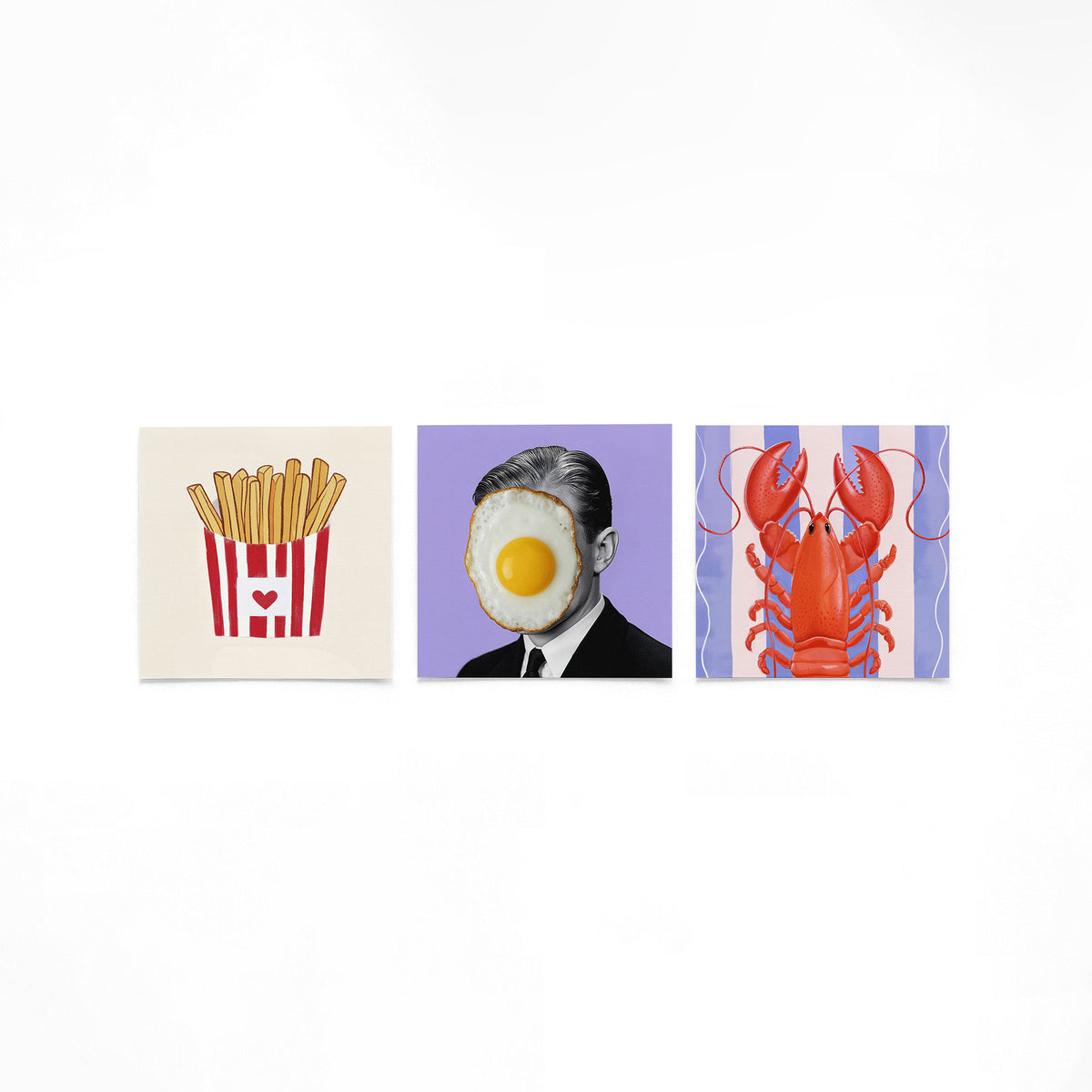 Drie vierkante posters met friet ei en kreeft op een gebroken witte achtergrond